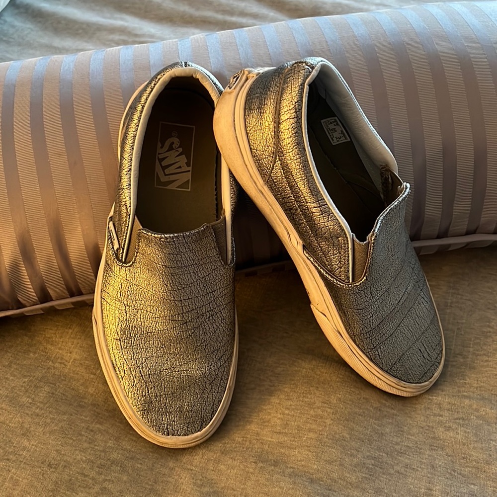 Women’s silver metallic slip-on Vans with white rubber sole